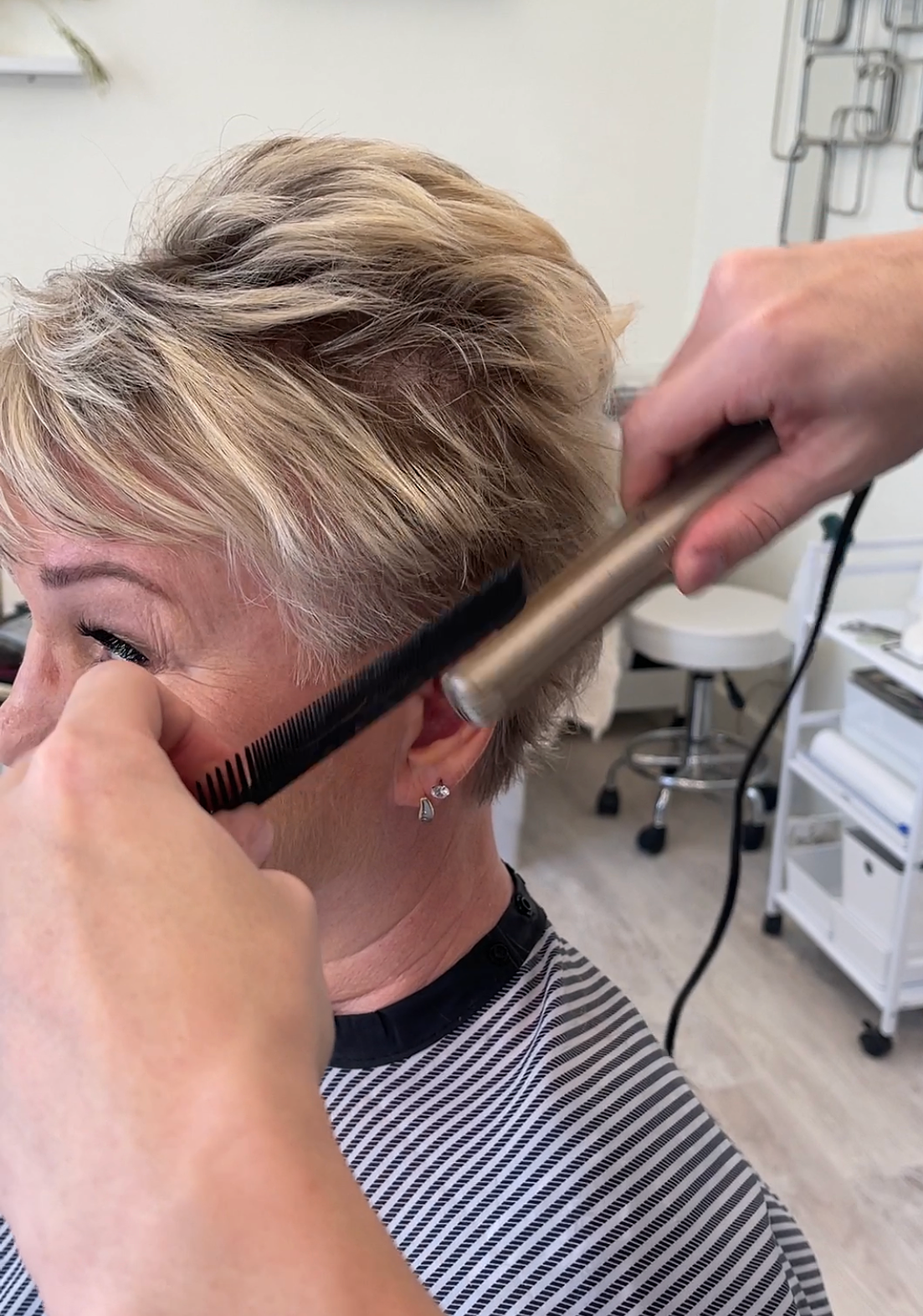 woman short haircut flatiron