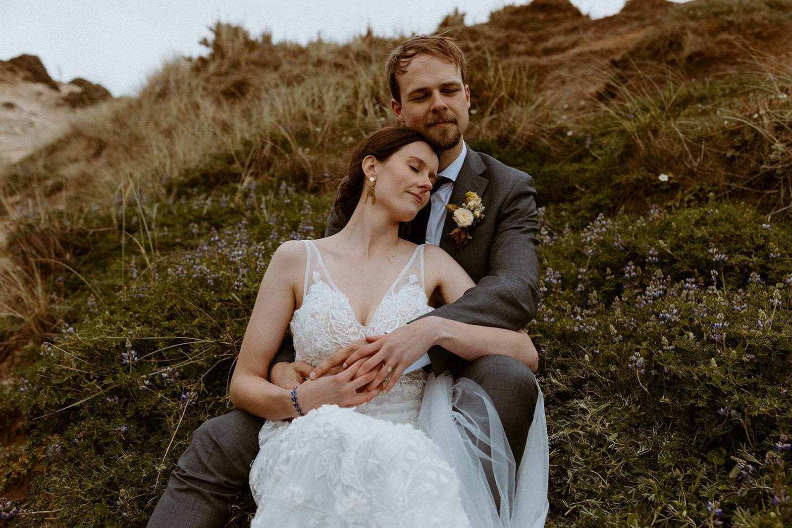 Portland bride with husband in canon beach Oregon for their elopement, wearing effortless hairstyle and natural makeup.