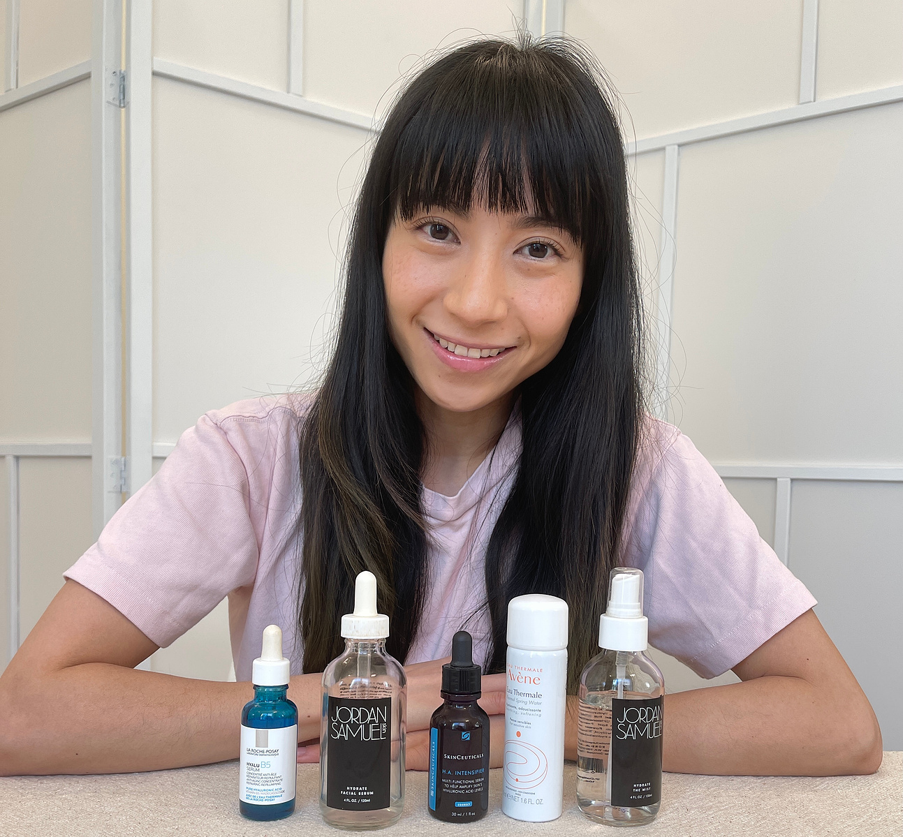 Cute face Asian girl in Portland Oregon with straight black hair, sharing skin product tips. 
