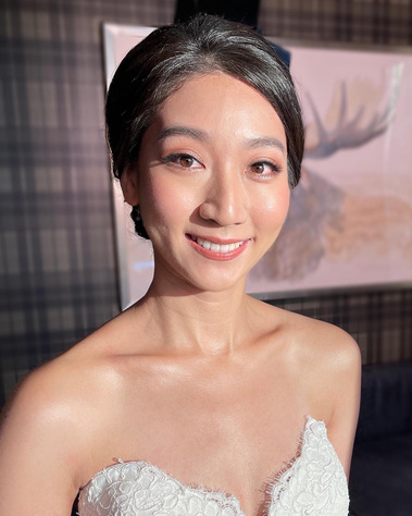 Korean style makeup, with glowy skin. Timeless updo hairstyle, low bun on the back.