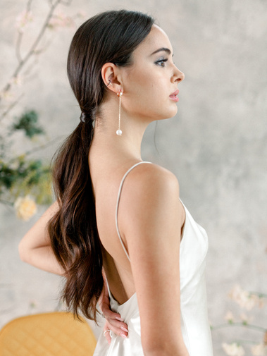 Gorgeous girl with clean and sophisticated low ponytail style, wavy ponytail look. Healthy glowy skin.