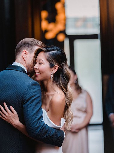 Asian bride have first dance with the groom.