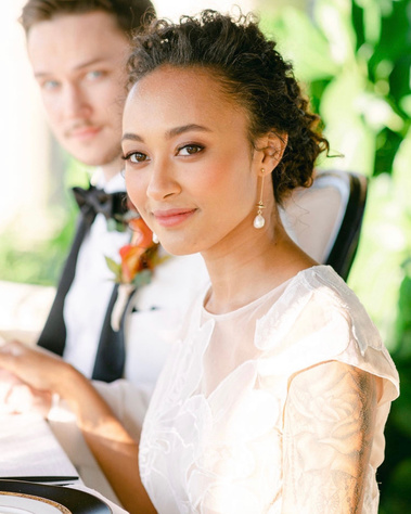 gorgeous ethnic bride kept her natural curly hair, beautiful glowy skin.