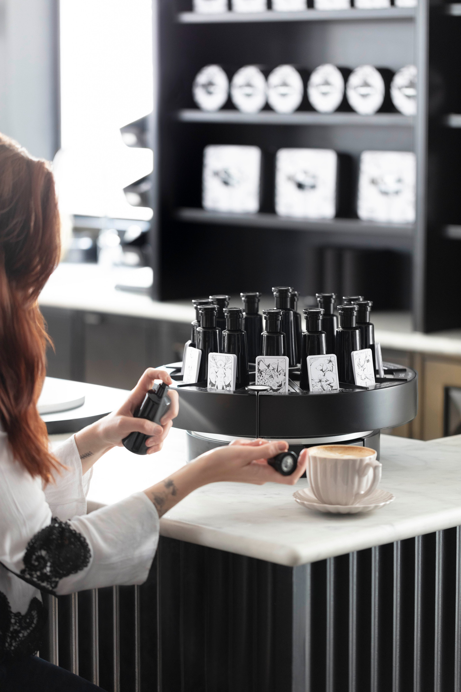 Argentum perfumery store photography, monochromatic styled shots of perfumes and products in a retail space