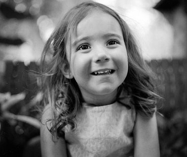 Flower girl, photographed at an outdoor wedding shot on medium format film and held in country Victoria, Australia, near Albury-Wodonga.