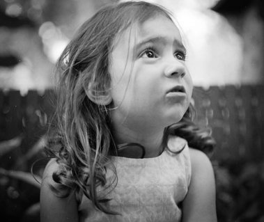 Flower girl, photographed at an outdoor wedding shot on medium format film and held in country Victoria, Australia, near Albury-Wodonga.