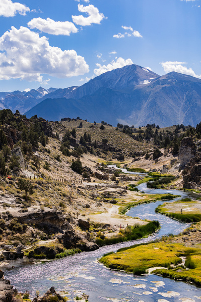 Hot Creek River (California) meanders with mountains in the background.