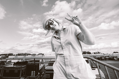 A black and white portrait of Natasha Bedingfield backstage at a festival in the UK