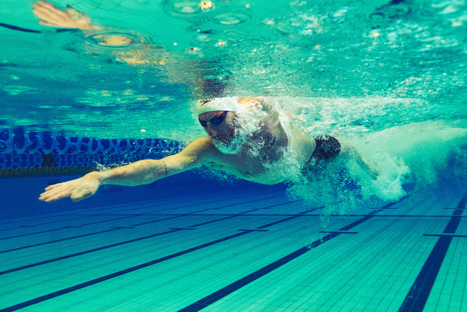 Olympic Swimmer Dan Wallace seen from underwater doing front crawl