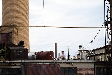 A self-portrait on the rooftop of a massive abandoned paper mill in New Jersey.