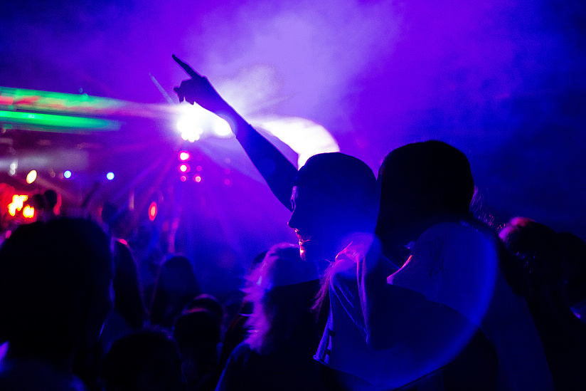 Surrounded by campers, Camp Romaca counselor Harrie Verges loses herself in the moment at "DJ Jeff" in the Rec Hall on July 11, 2019.