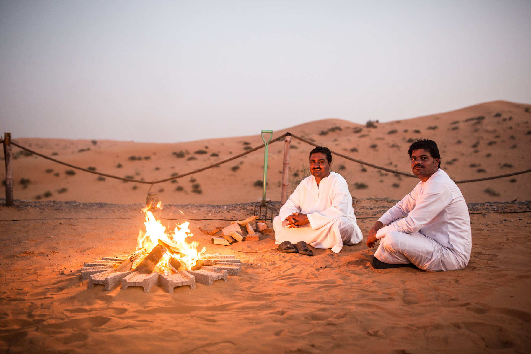 Locals enjoying a fire in the Dubai desert