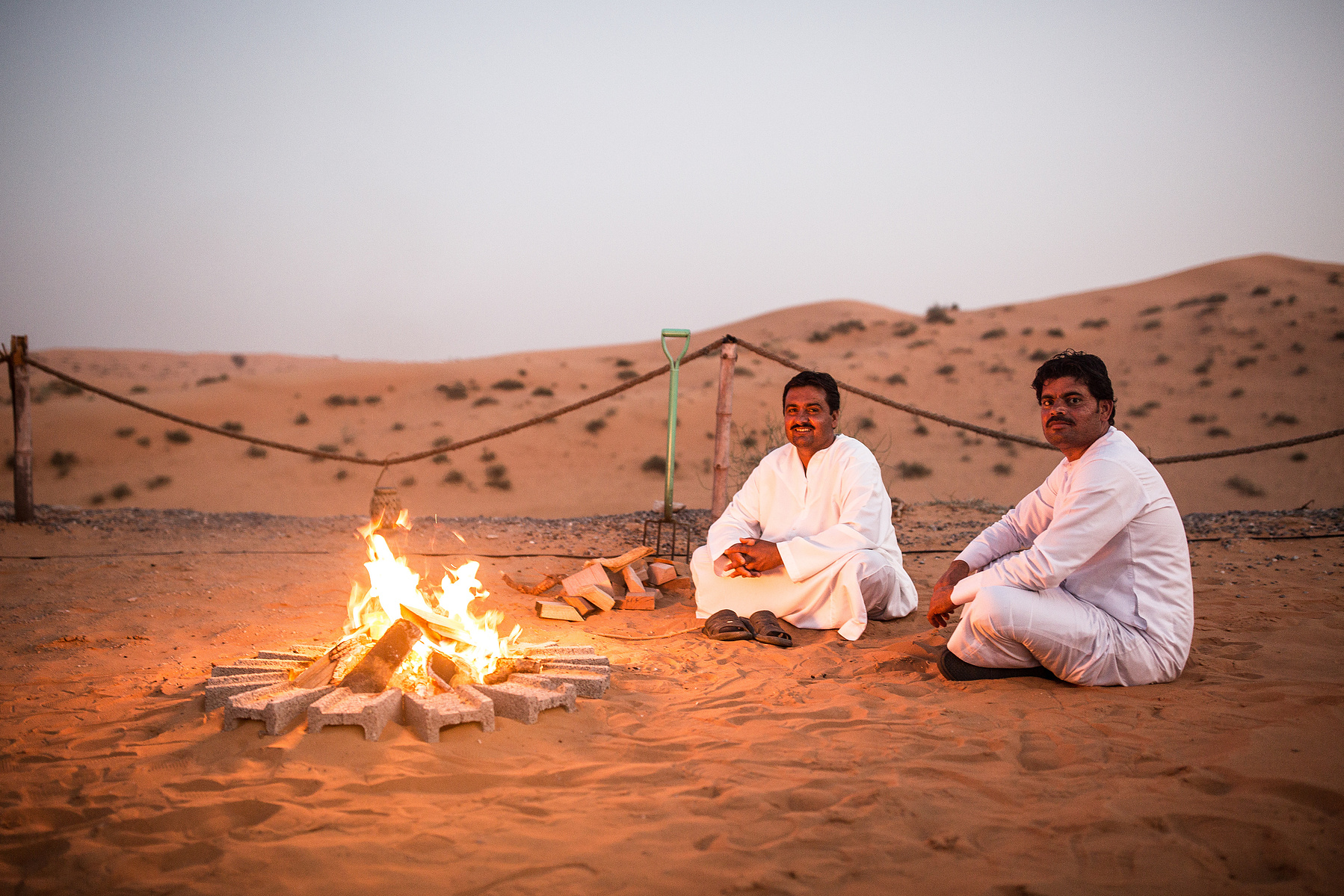 Locals enjoying a fire in the Dubai desert