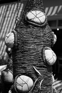 Black and white photo of a statue with rocks calved into it.