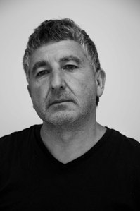 An aged man with grey hair black and white image.
