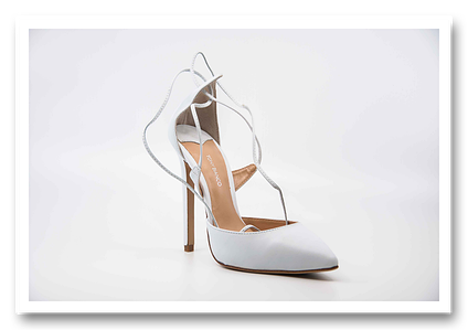 White Tony Bianco high heel shoe, with white background.
