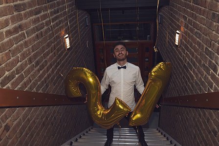 21st birthday party, man holding 21 sign