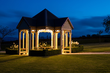 Night photography, outside wedding venue. beautiful cut grass and beautiful building.