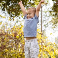 Little one celebrating with raised hands