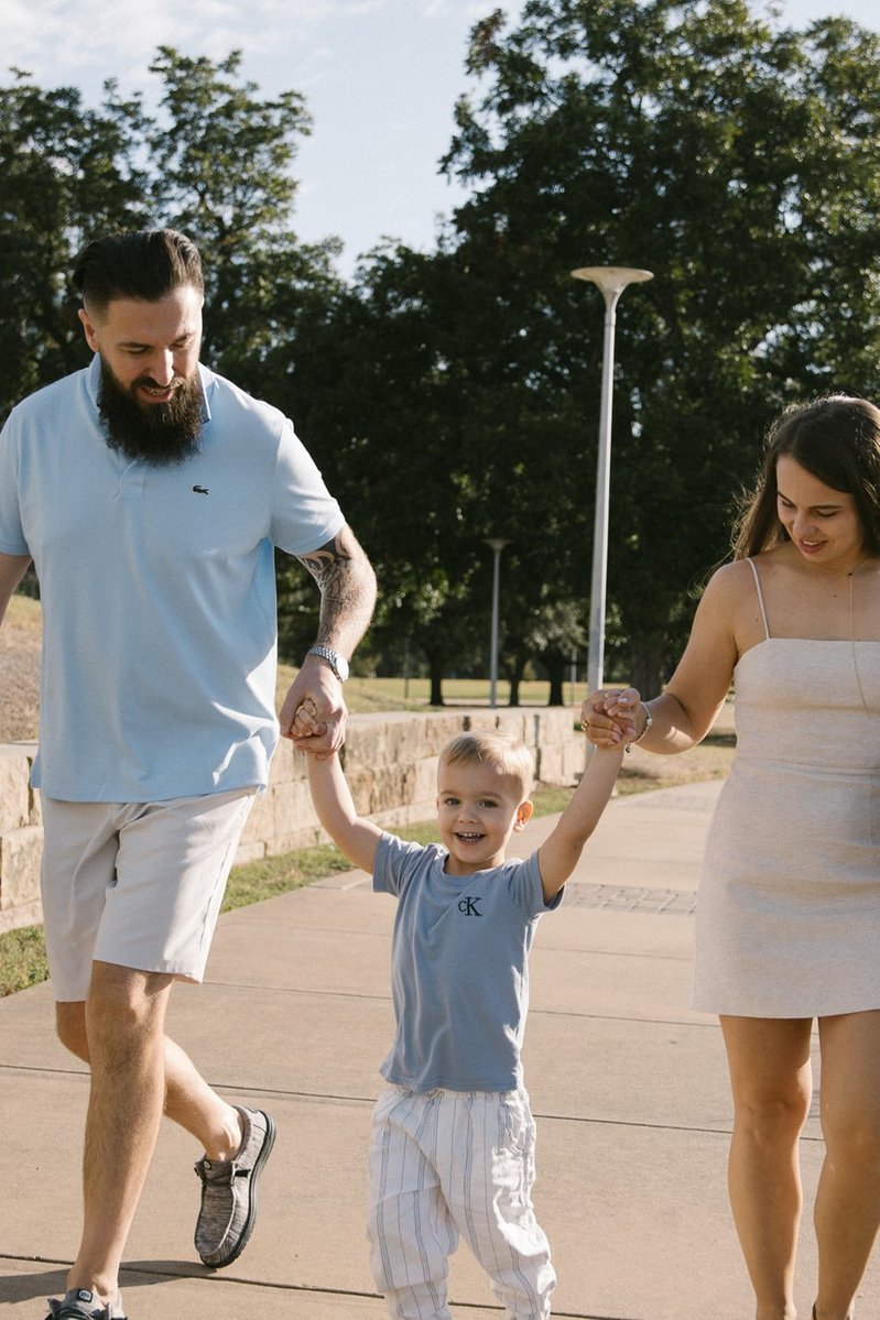Riverside moment with family of three