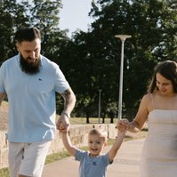 Riverside moment with family of three