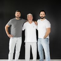 Father and sons — clean studio portrait