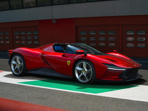 Ferrari Daytona SP3 showcasing its sleek design and vibrant red color. enquire with us at west2east
