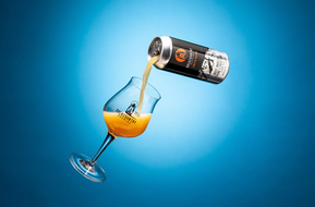 BEER BEING POURED INTO A GLASS