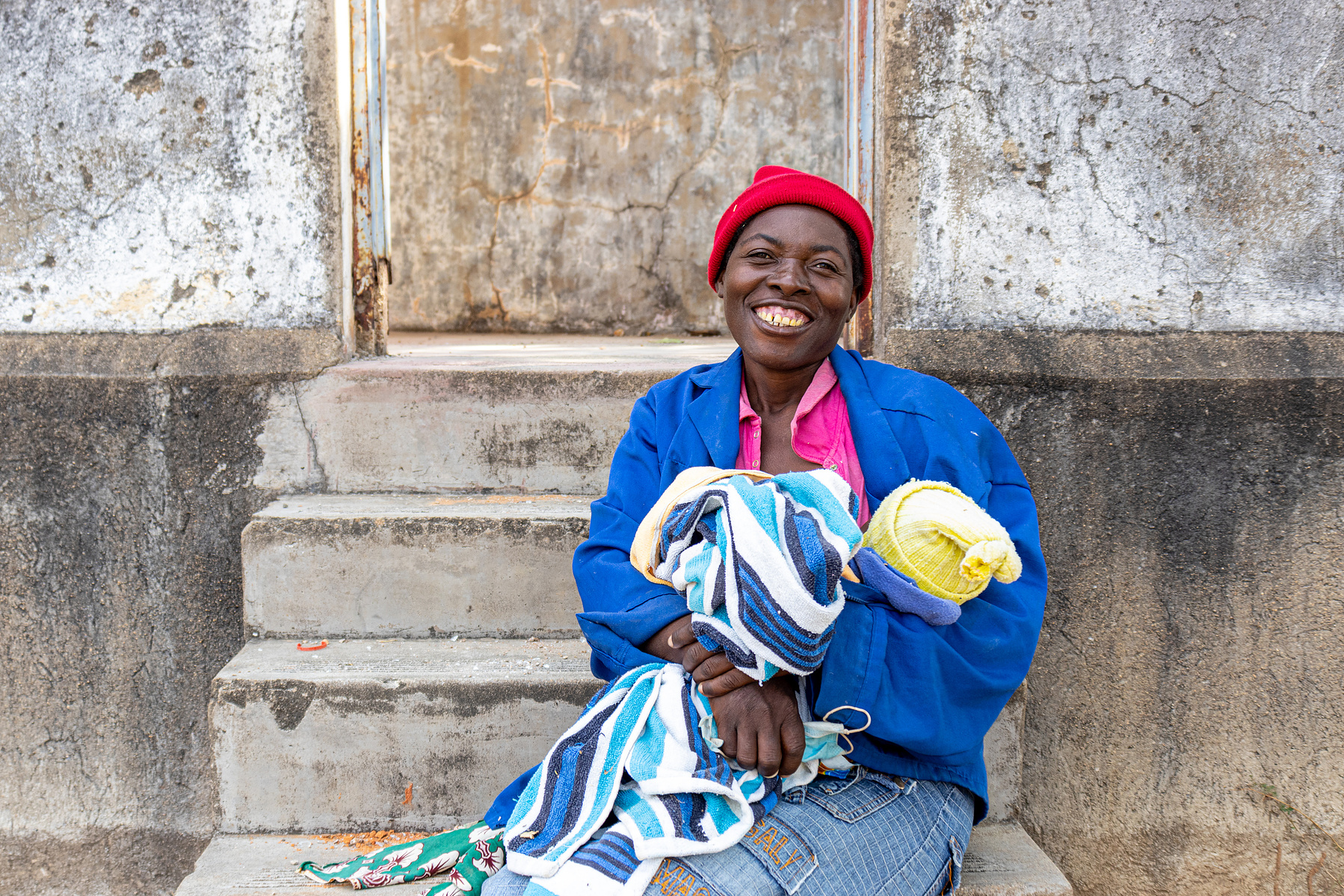 MAY 31, 2021: At 43 years old, SEBINA MASUKUTA carried eight pregnancies to term- four of them being home births, “My last pregnancy was difficult. I didn’t have enough to eat, and the baby kept threatening to present early because of my asthma attacks. M