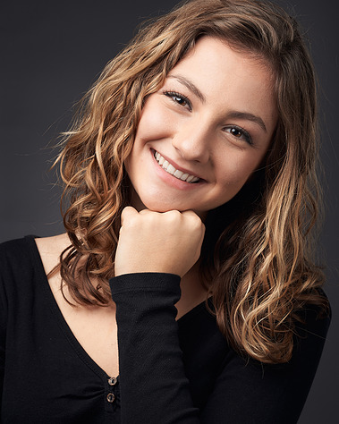 Headshot of a high school senior outdoors