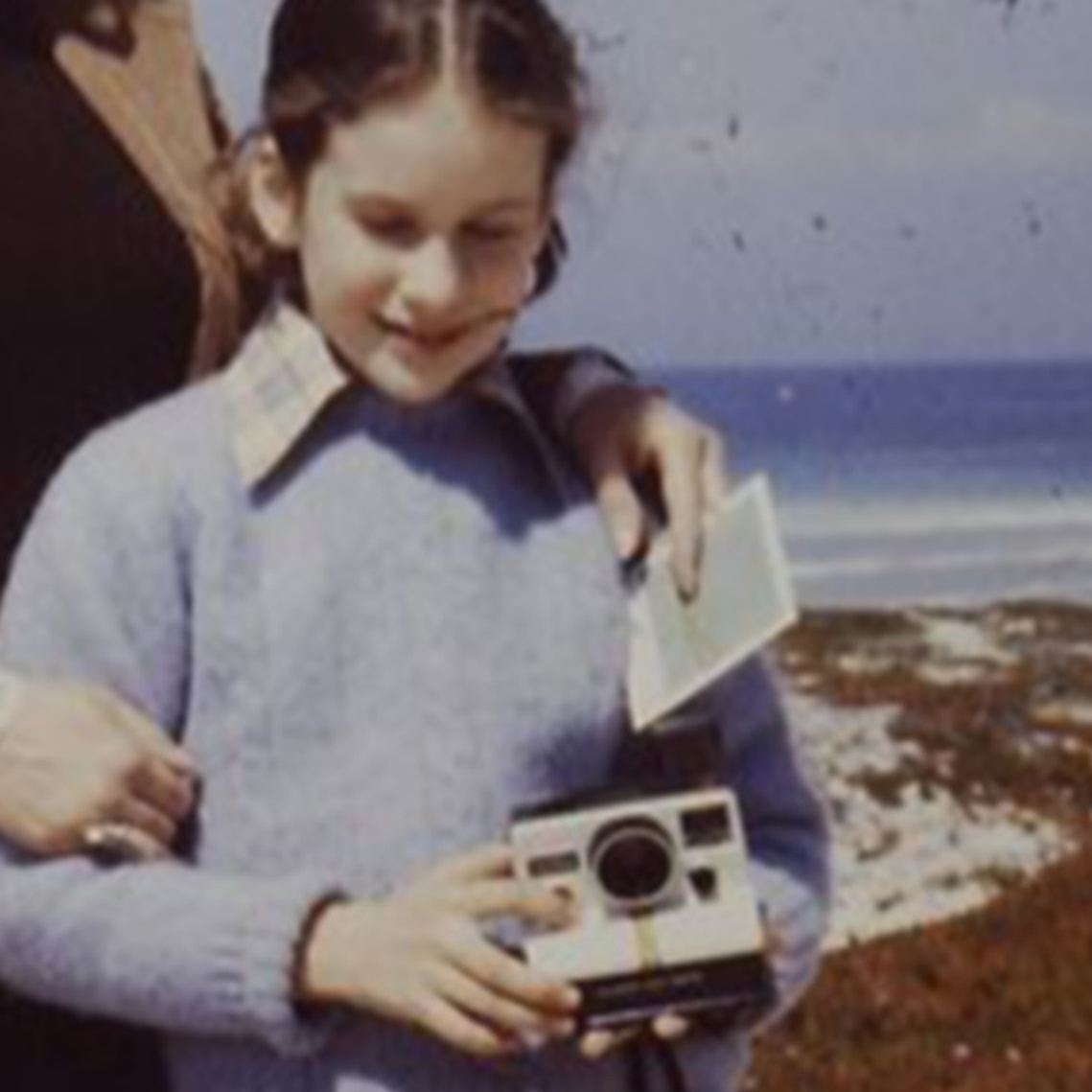 Melissa Cooperman with family and her first Polaroid camera.