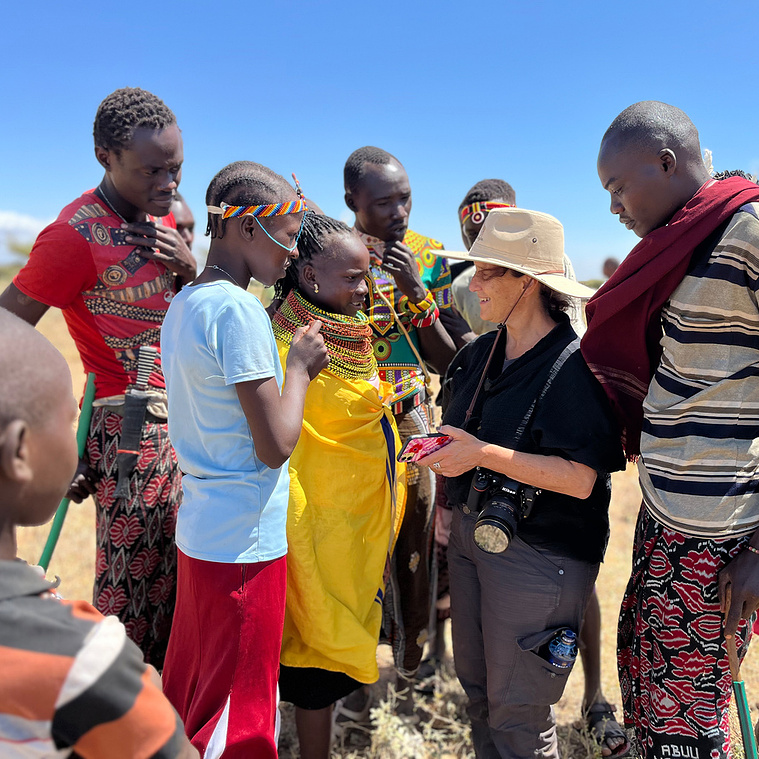 Melissa Cooperman on assignment for photojournalism and video in Isiolo, Kenya. Connecting with young woman who veru kindly helped me not fall into a huge thorny acacia tree while walking backwards filming.