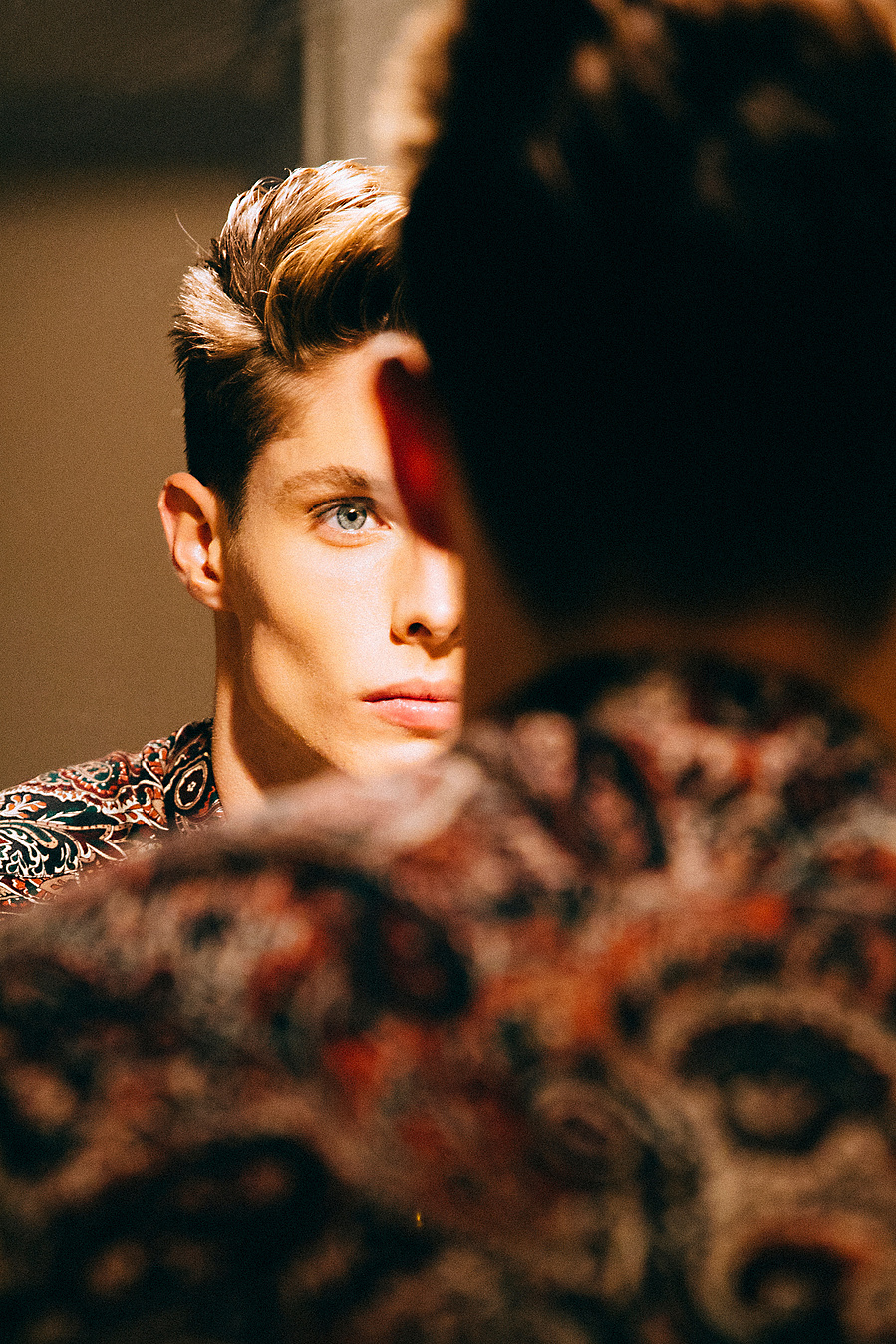 Male Model looking in the mirror fashion photography