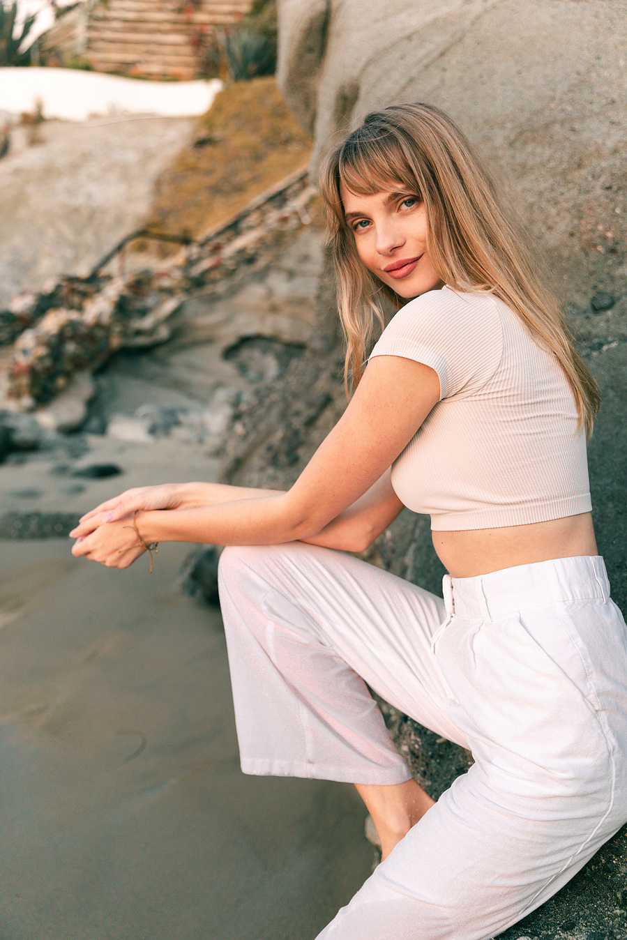 Fashion model sitting on beach in Los Angeles Editorial photoshoot