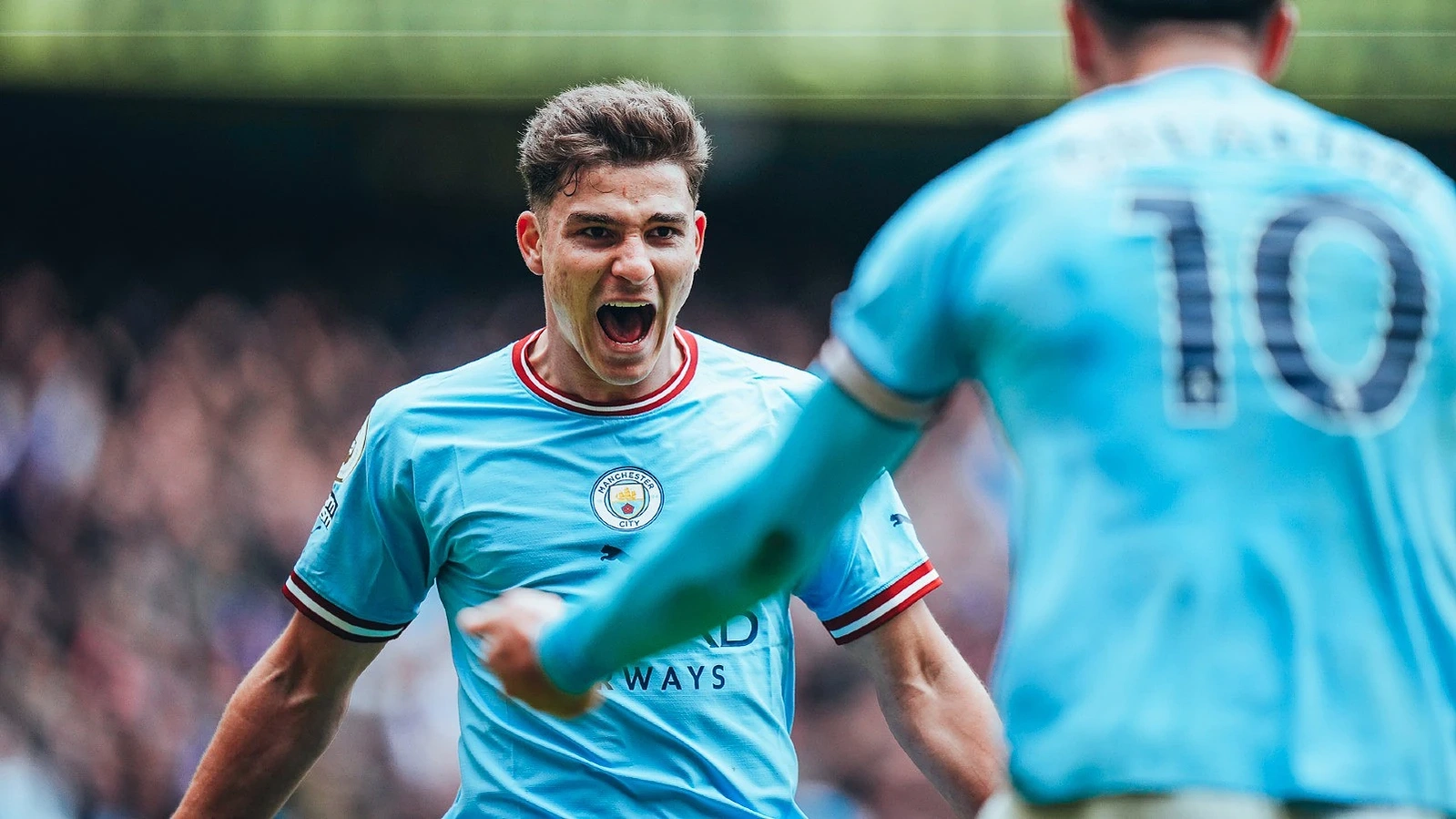 Julian Alvarez celebrates his goal with teammate, Jack Grealish against Liverpool. 