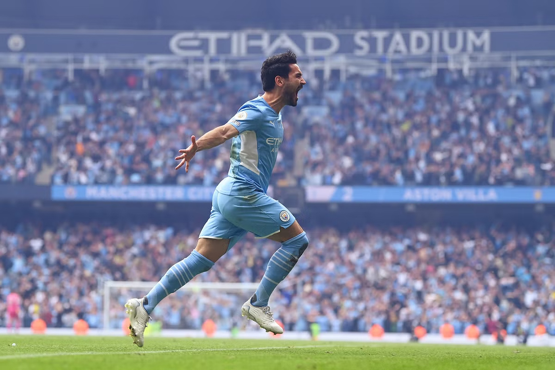 Ilkay Gundogan celebrates scoring a dramatic, last-minute, title-winning goal against Aston Villa in the 2022 Premier League season. 
