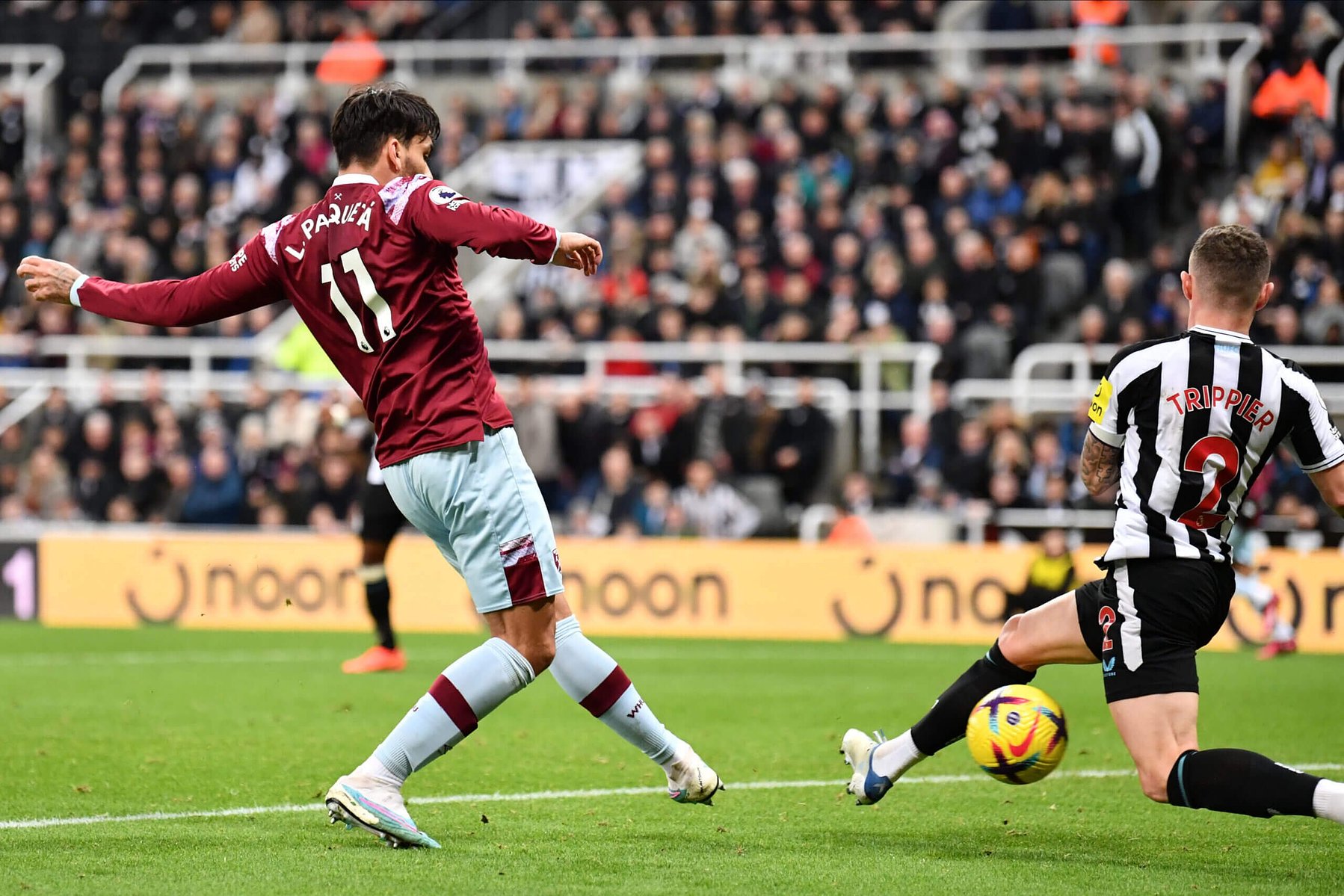 Lucas Paquetá takes on Kieran Trippier of Newcastle.