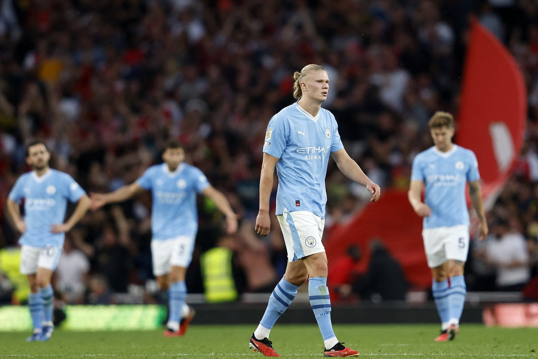 City players leave the pitch after their league loss against Arsenal. 