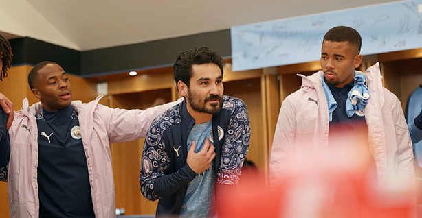 Captain Gundogan gives an inspiring locker room speech as former City players Raheem Sterling and Gabriel Jesus listen intently. 