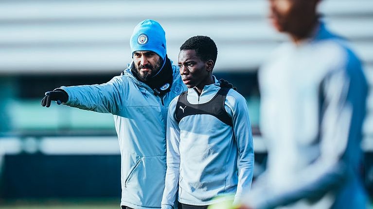 Gundogan provides tactical instructions to a City youth player while preparing for his official coaching license. 