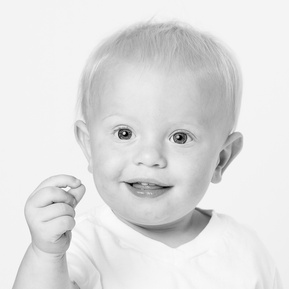 baby boy grinning in black and white