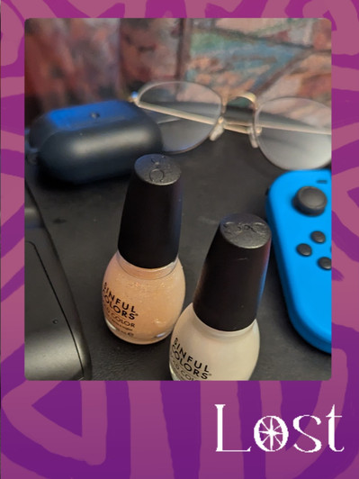 Gallery Image: Text reads: LOST. On a purple border around a close-up image of two bottles of nail polish in white and light pink/beige. Also visible is the blue controller for a Nintendo Switch, a pair of wire glasses and a black bluetooth earphone case.