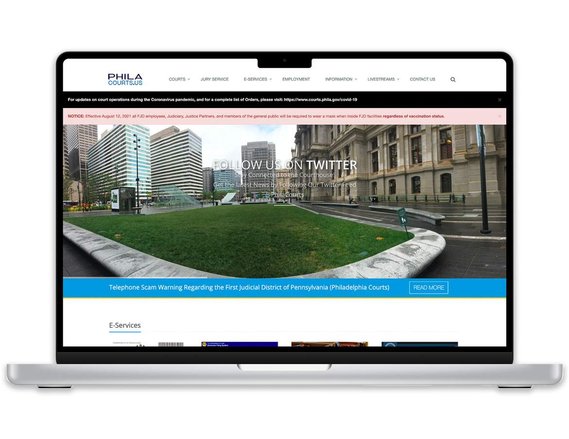 Laptop mockup displaying old Philadelphia Courts website 