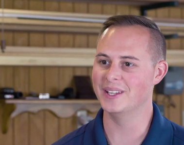 man smiling, being interviewed