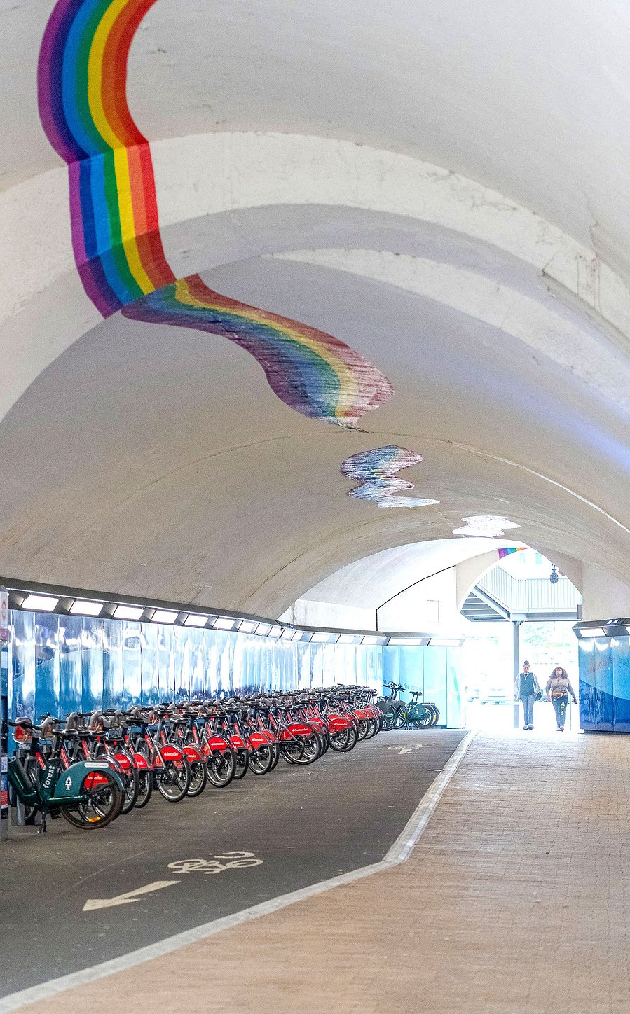 london lifestyle photography, bicycles lined up in tunnel
