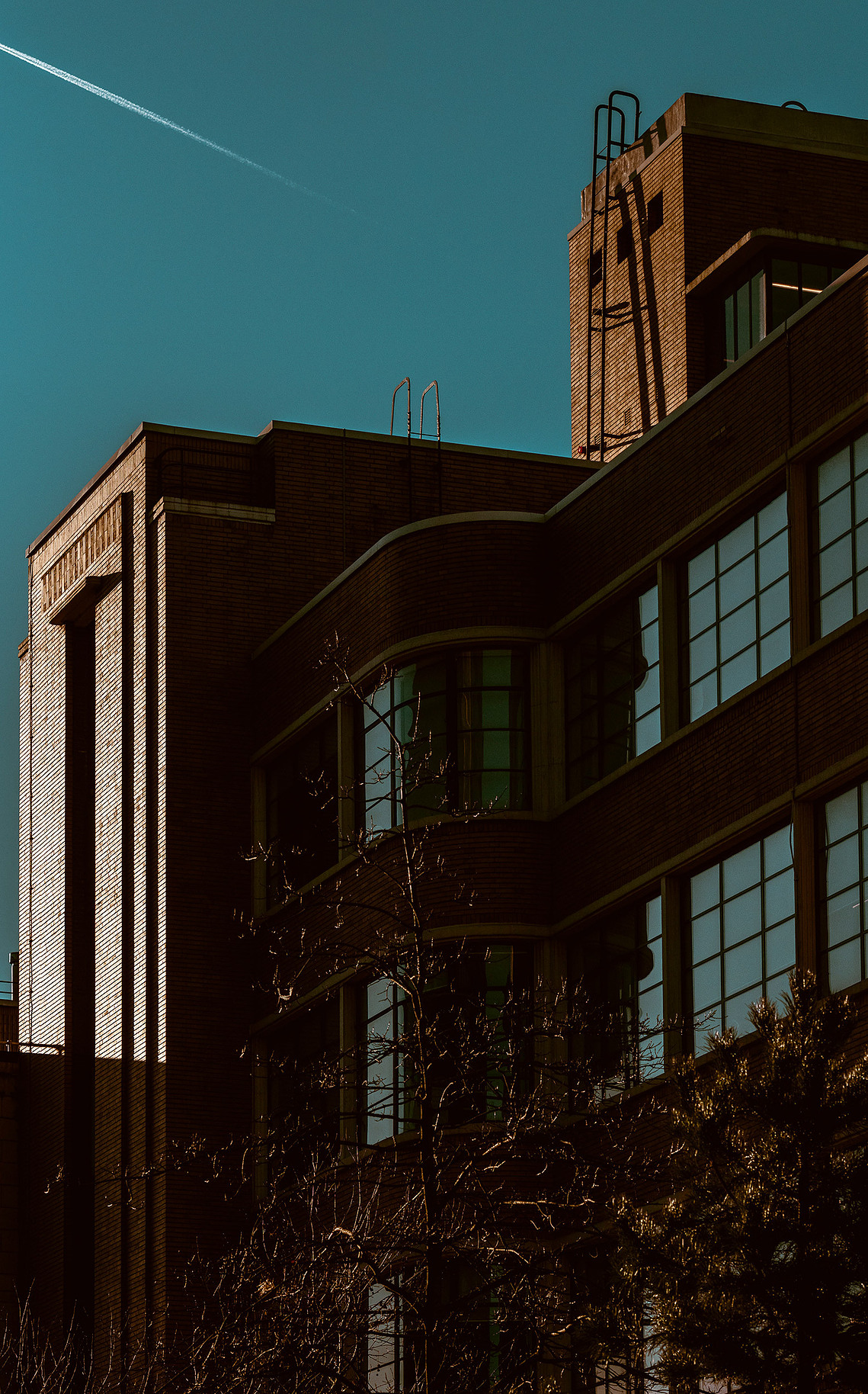 Cropped in Manchester City skyline  with blue sky old red brick building