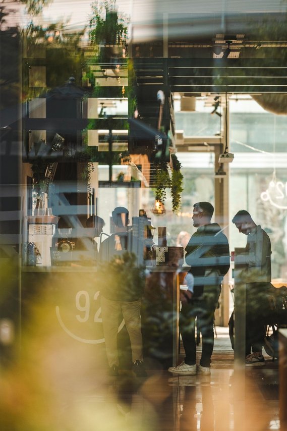 URBAN LIFESTYLE AND LOCAL AREA PHOTOGRAPHY OF SPINNINGFIELDS, MANCHESTER, lifestyle photography showing people inside a coffee shop queueing at counter