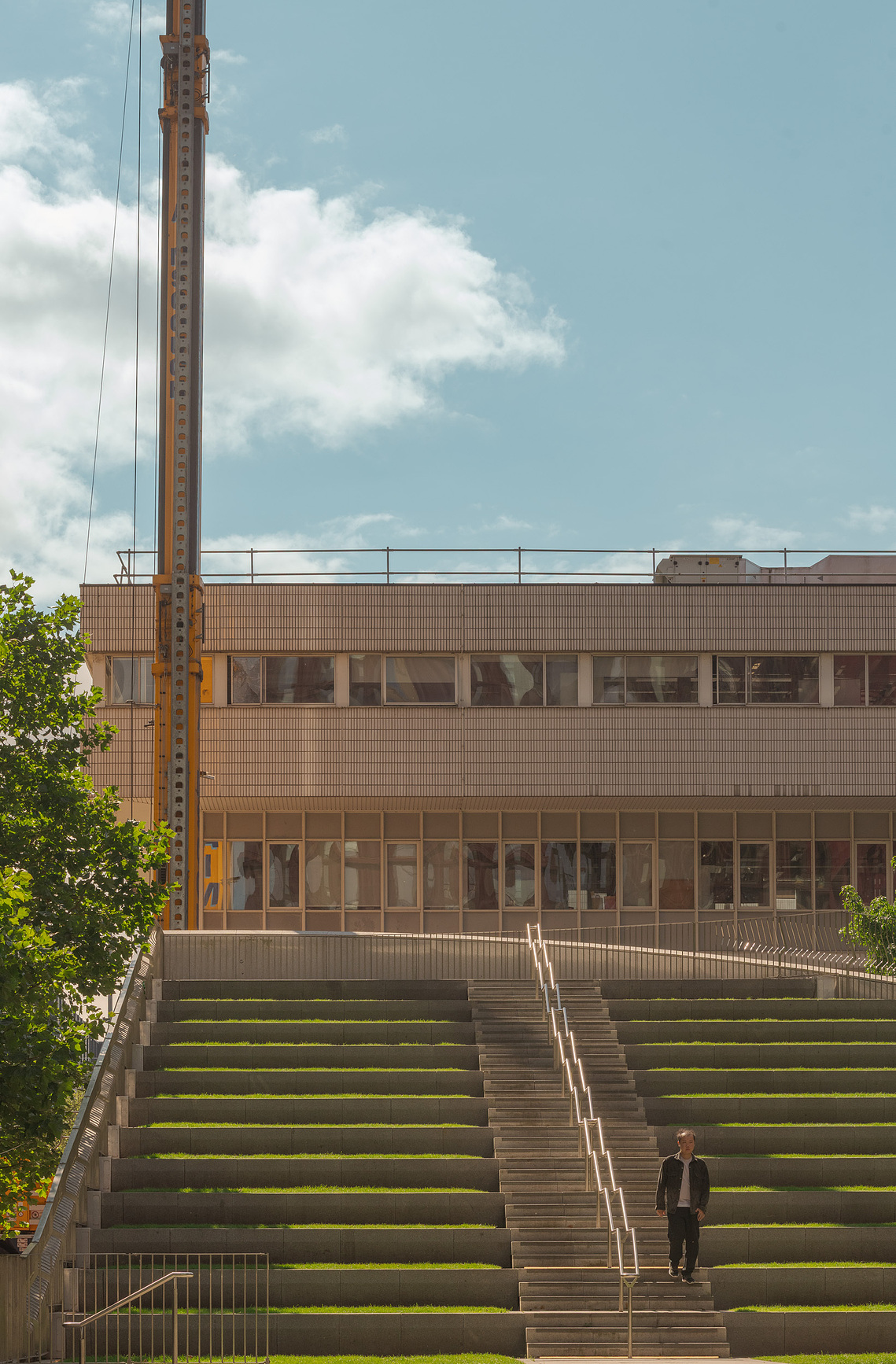 circle square manchester, tiered seating with solo figure, architectural lifestyle photography Manchester

