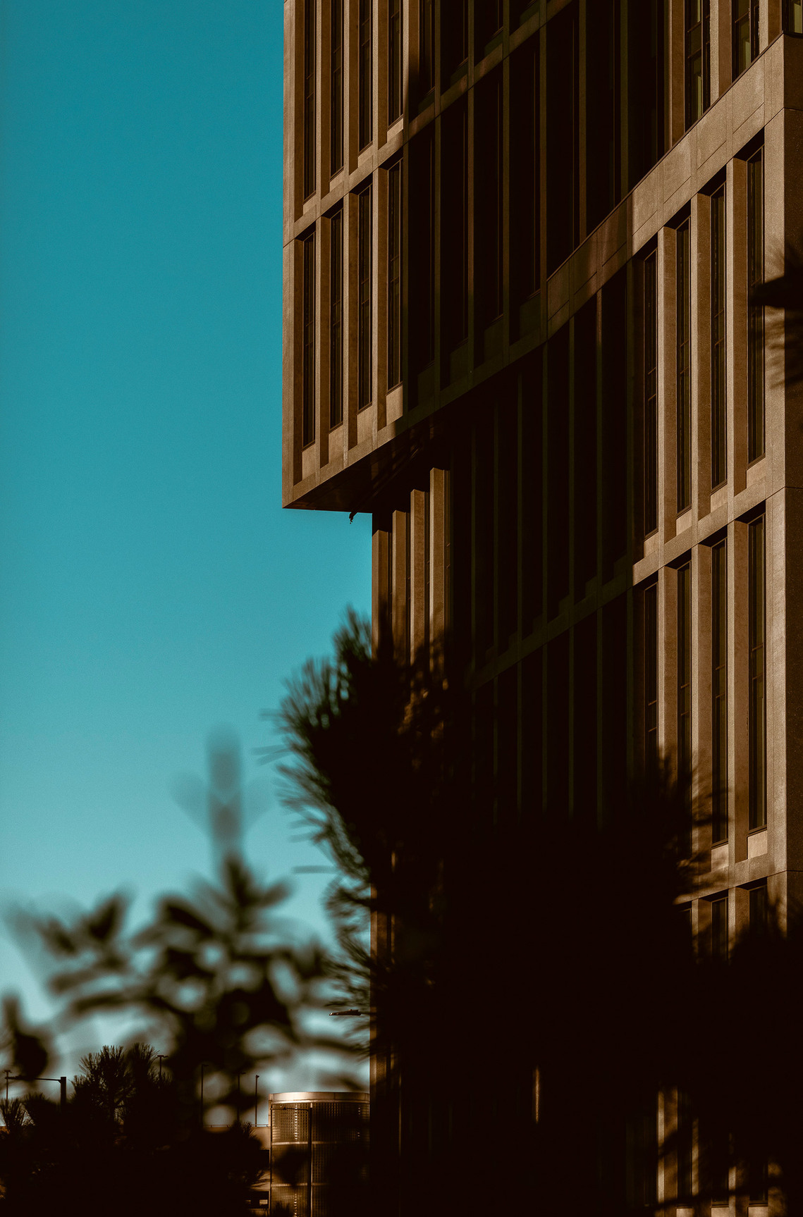 cropped image of edge of modern city building against blue sky