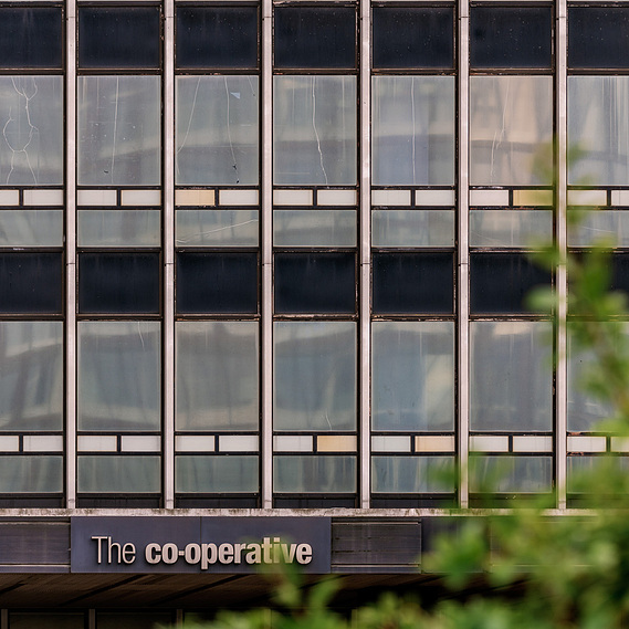 Placemaking architecture photography showing the CIS Building. Old cooperative signage visible 